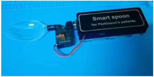 Assistive spoon for patients with parkin